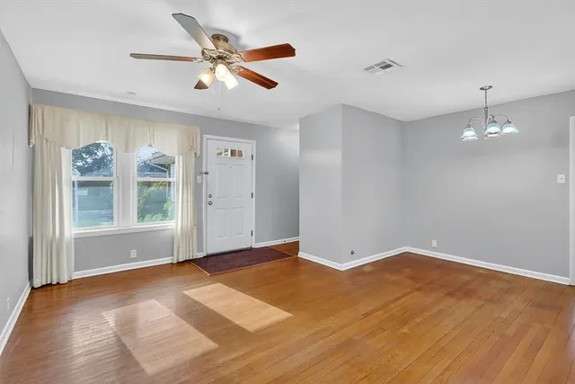 a view of an empty room with a window
