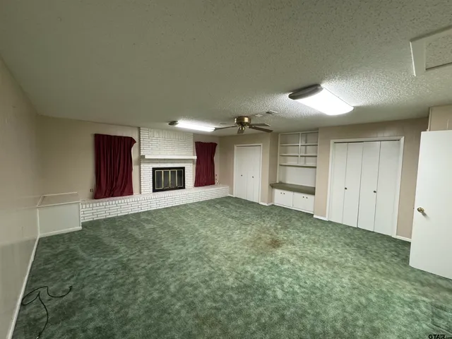 a big room with closet and windows