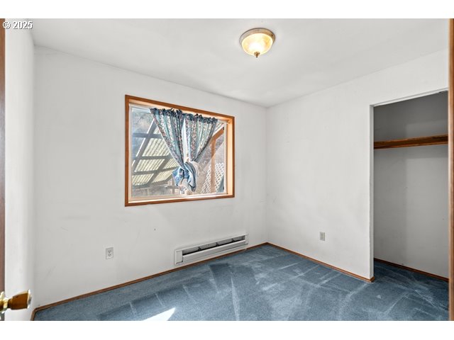 387 East Linden Way Heppner, OR 97836 - Photo 12 of 37 an empty room with a window