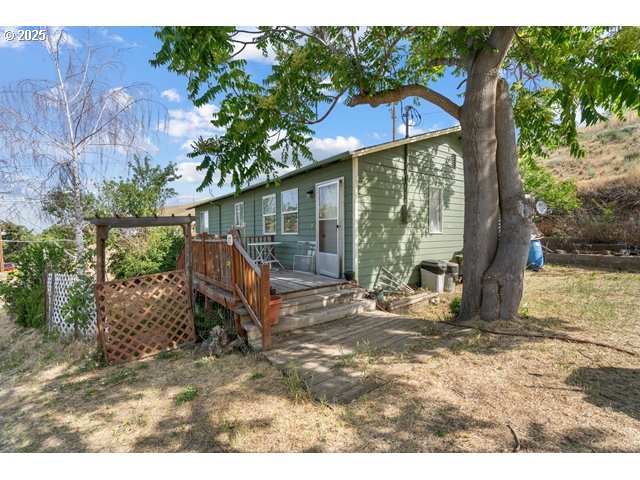 387 East Linden Way Heppner, OR 97836 - Photo 17 of 37 a backyard of a house with table and chairs