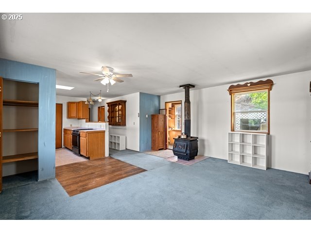 387 East Linden Way Heppner, OR 97836 - Photo 6 of 37 a living room with furniture and a chandelier