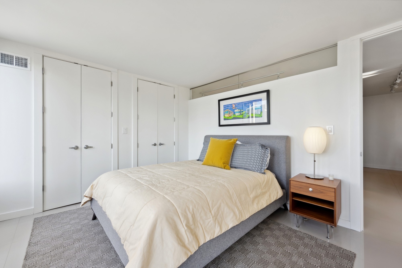 100 East Walton Street, Unit 32FG Chicago, IL 60611 - Photo 17 of 30 a bedroom with a bed and a painting on the wall