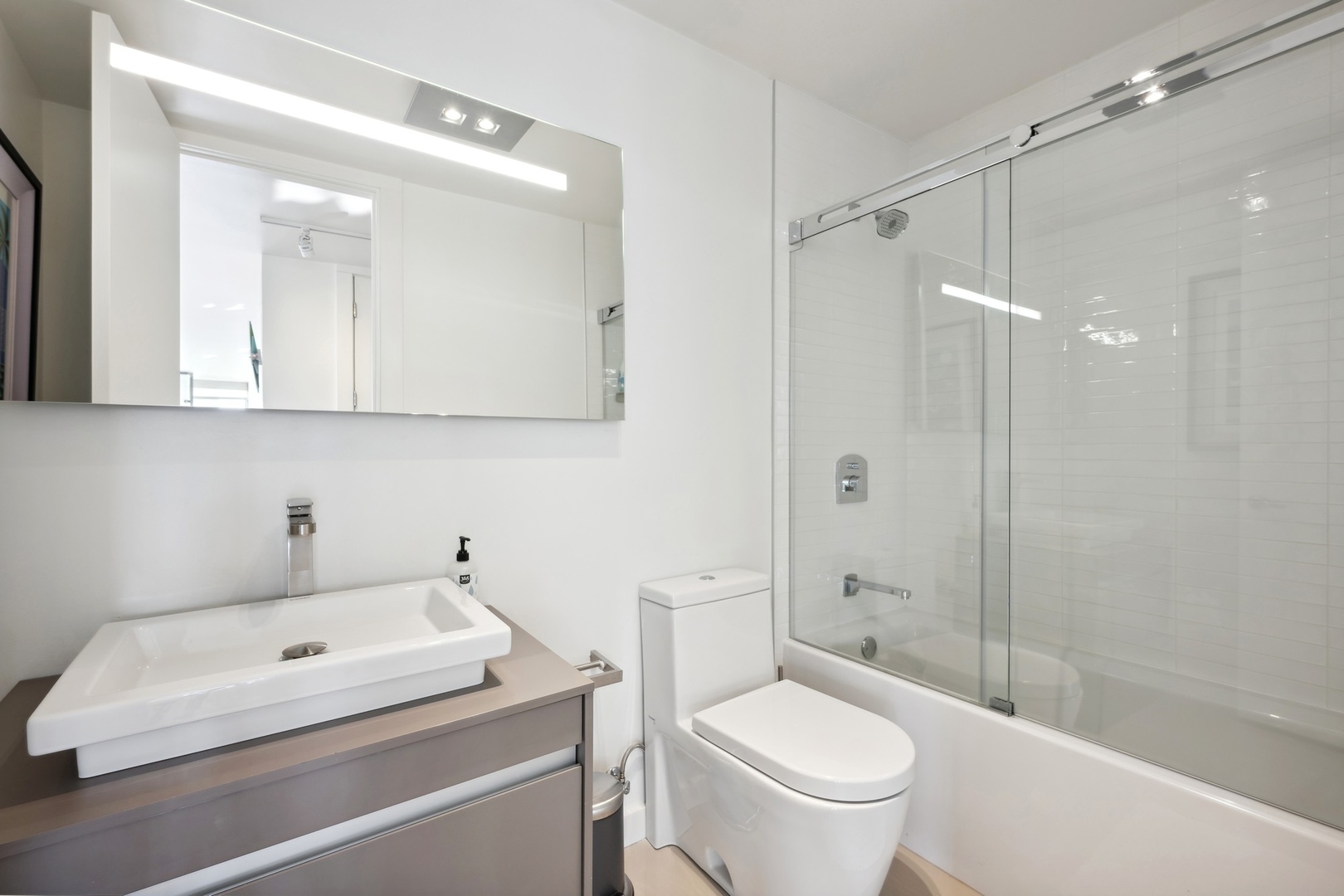 100 East Walton Street, Unit 32FG Chicago, IL 60611 - Photo 18 of 30 a bathroom with a sink a toilet and shower