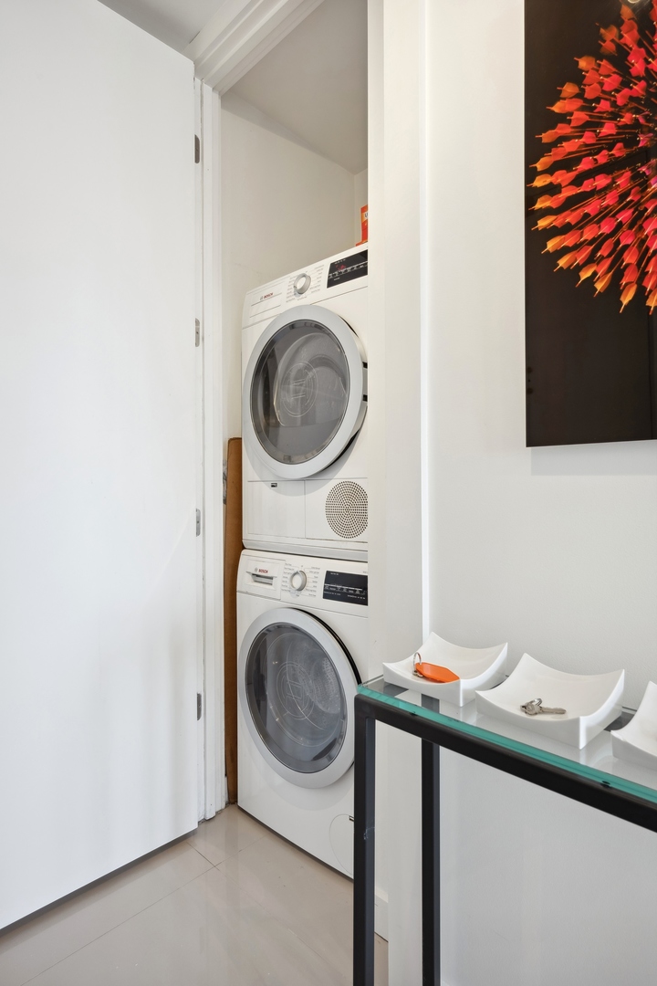 100 East Walton Street, Unit 32FG Chicago, IL 60611 - Photo 19 of 30 a utility room with dryer and washer