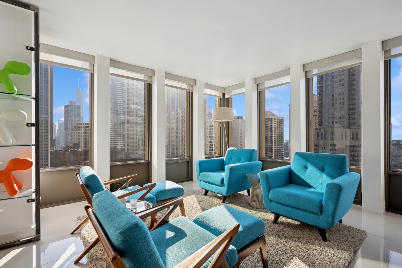 100 East Walton Street, Unit 32FG Chicago, IL 60611 - Photo 5 of 30 a living room with furniture and a large window