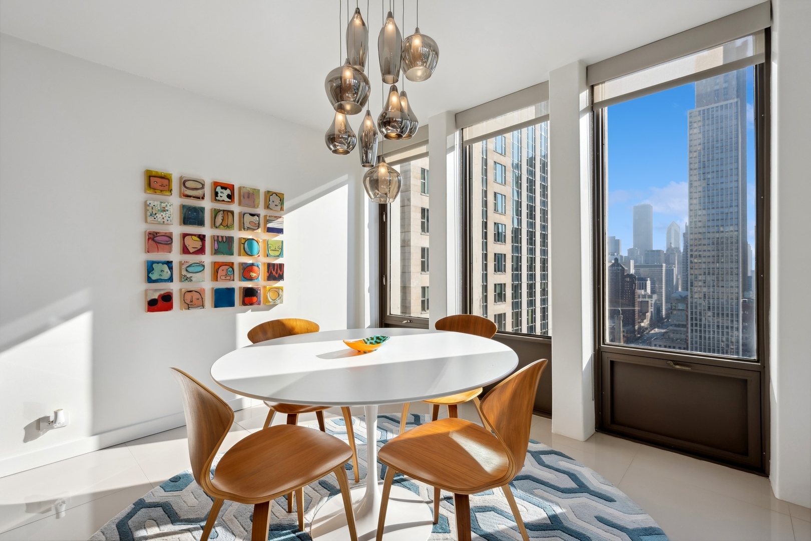 100 East Walton Street, Unit 32FG Chicago, IL 60611 - Photo 9 of 30 a view of a dining room with furniture and window
