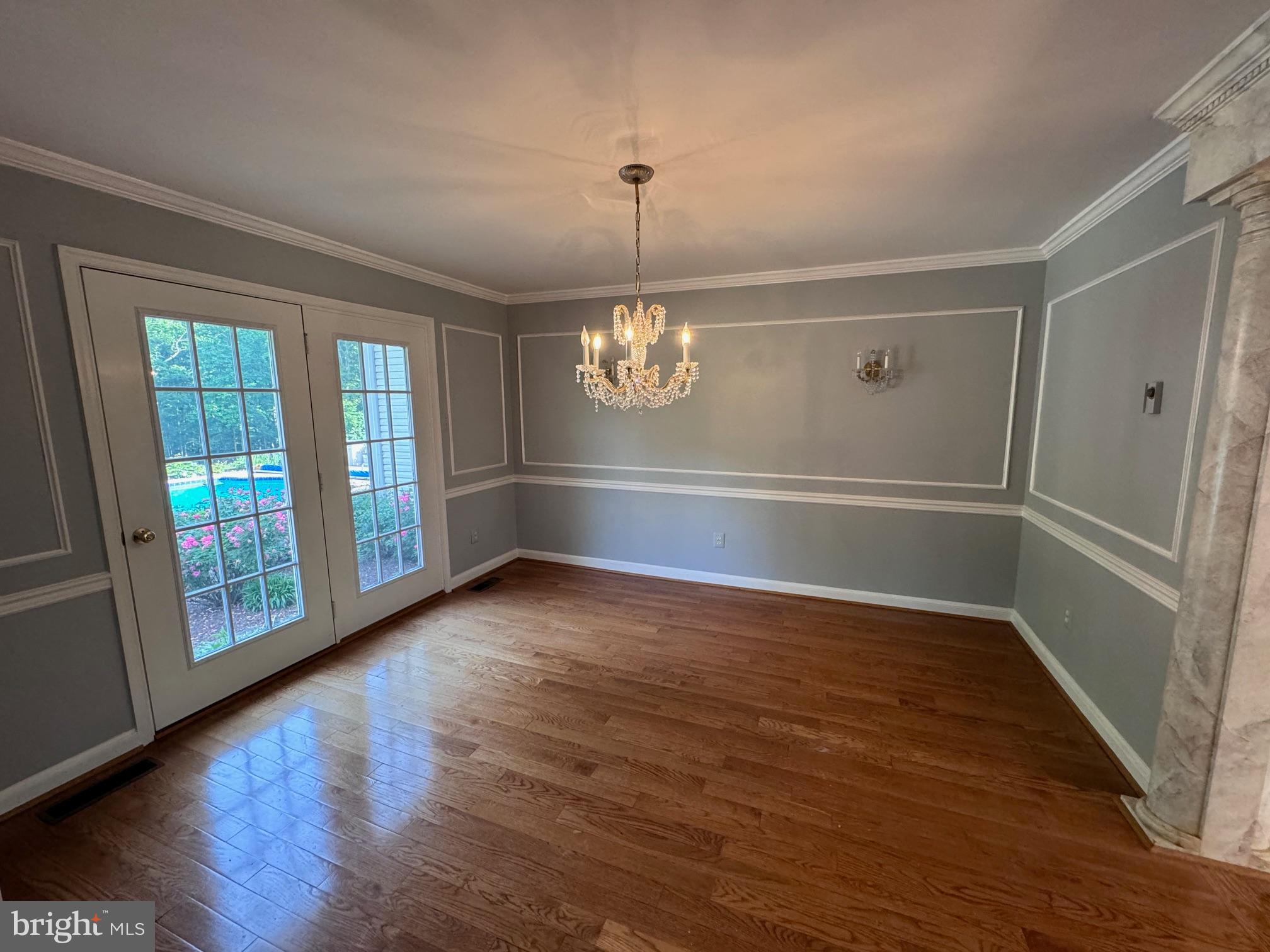 6375 Union Mill Road Clifton, VA 20124 - Photo 13 of 34 a view of an empty room with wooden floor and a window
