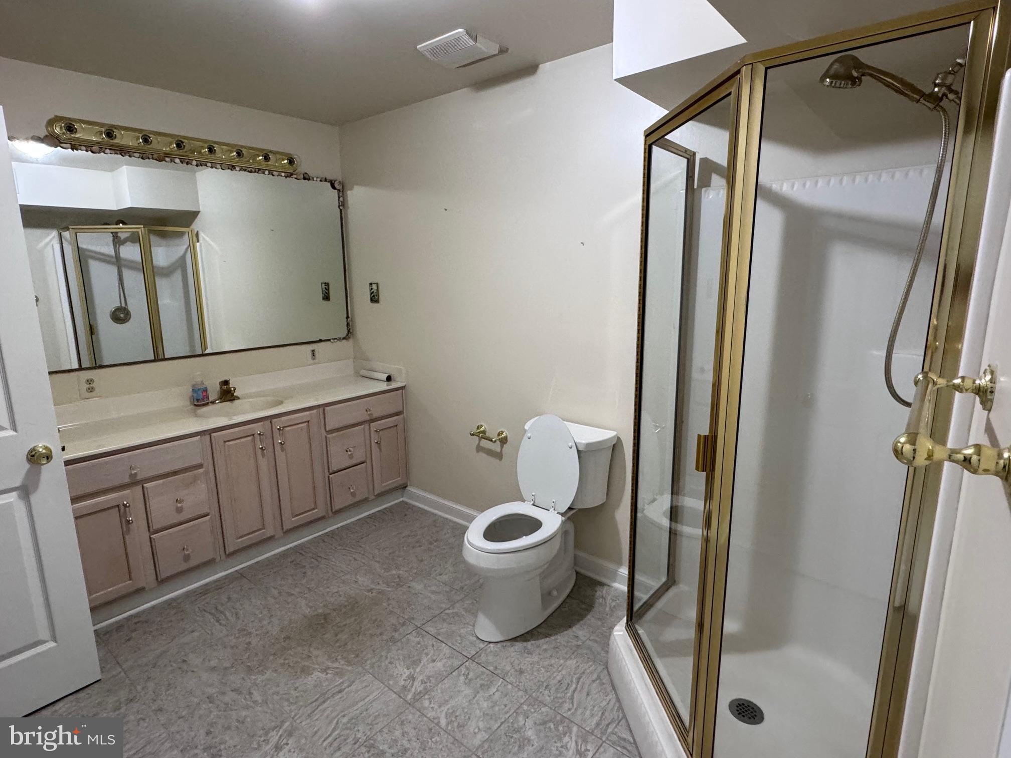 6375 Union Mill Road Clifton, VA 20124 - Photo 20 of 34 a bathroom with a granite countertop sink toilet and shower