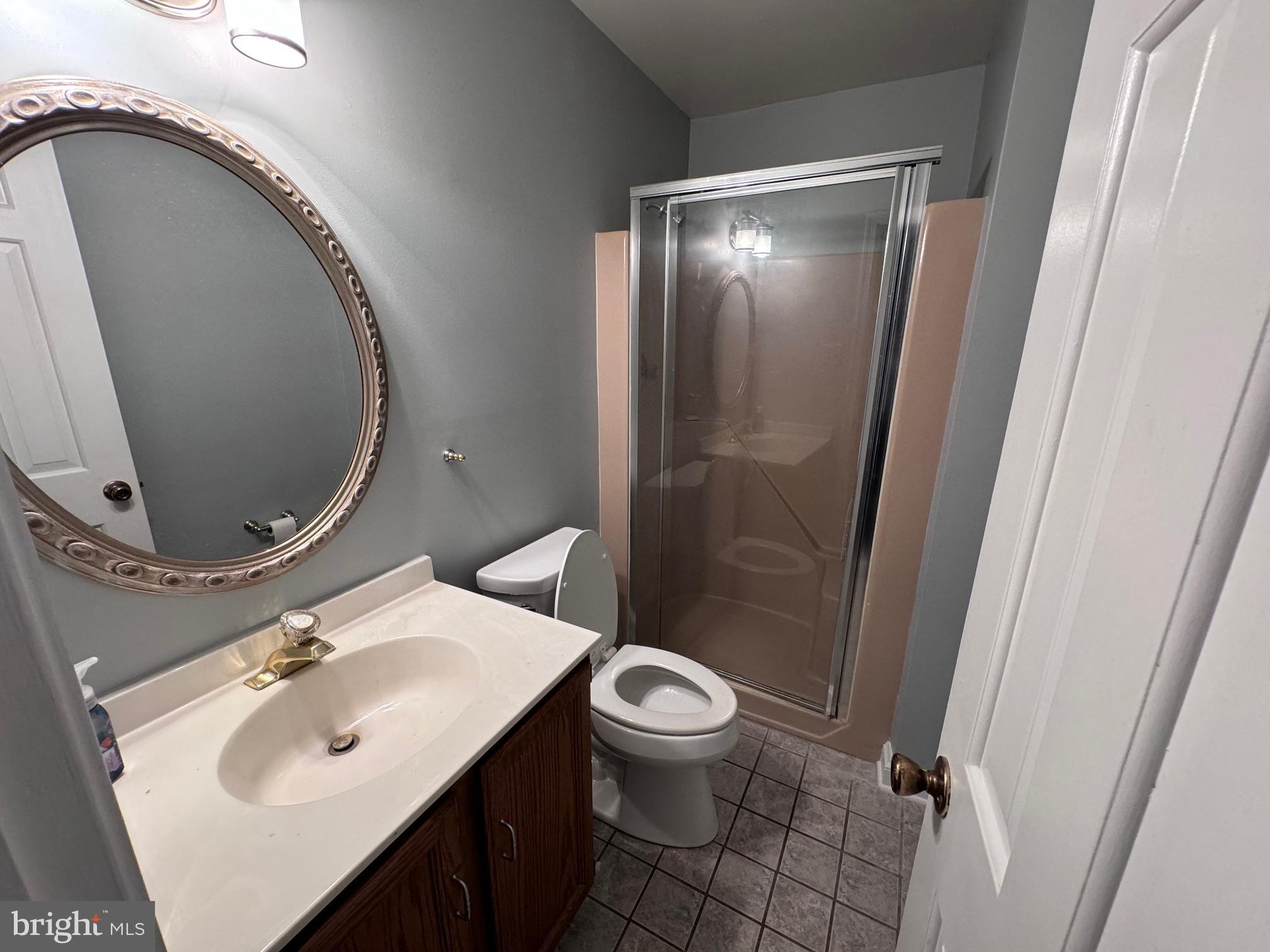 6375 Union Mill Road Clifton, VA 20124 - Photo 24 of 34 a bathroom with a sink toilet and shower