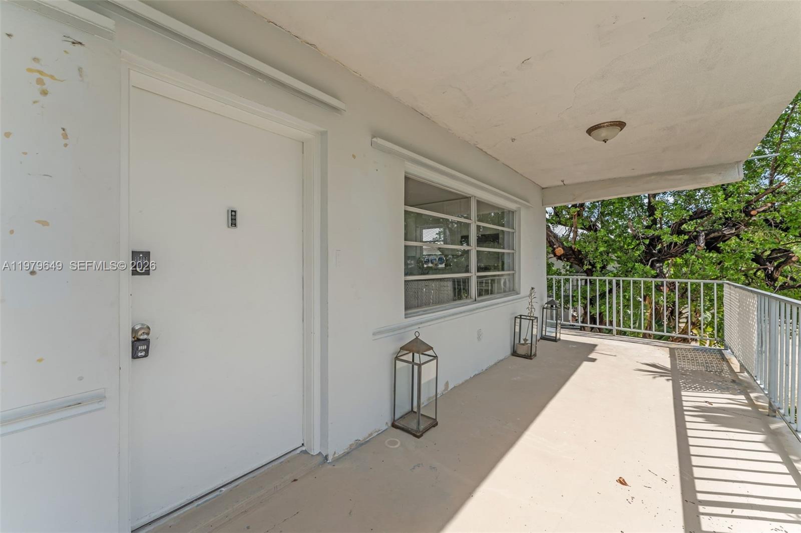 174 Corrine Place, Unit 1 Key Largo, FL 33037 - Photo 14 of 17 a view of a balcony with wooden floor