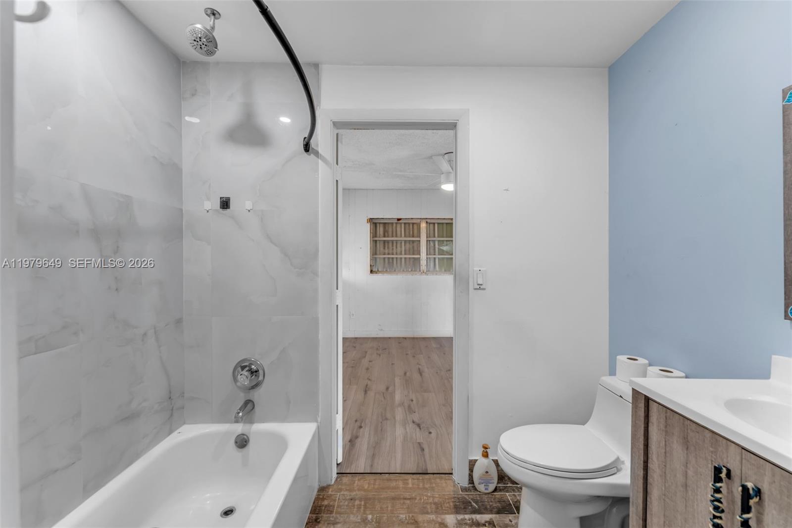 174 Corrine Place, Unit 1 Key Largo, FL 33037 - Photo 15 of 17 a bathroom with a sink a toilet and shower