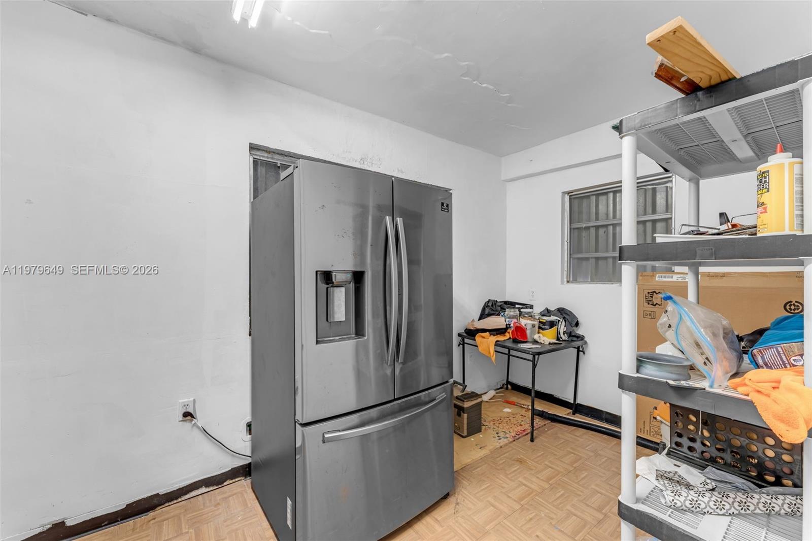 174 Corrine Place, Unit 1 Key Largo, FL 33037 - Photo 7 of 17 a kitchen with stainless steel appliances granite countertop a refrigerator and a sink