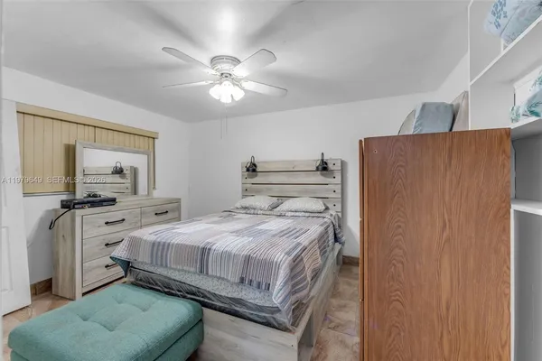 a bedroom with a bed and a couch