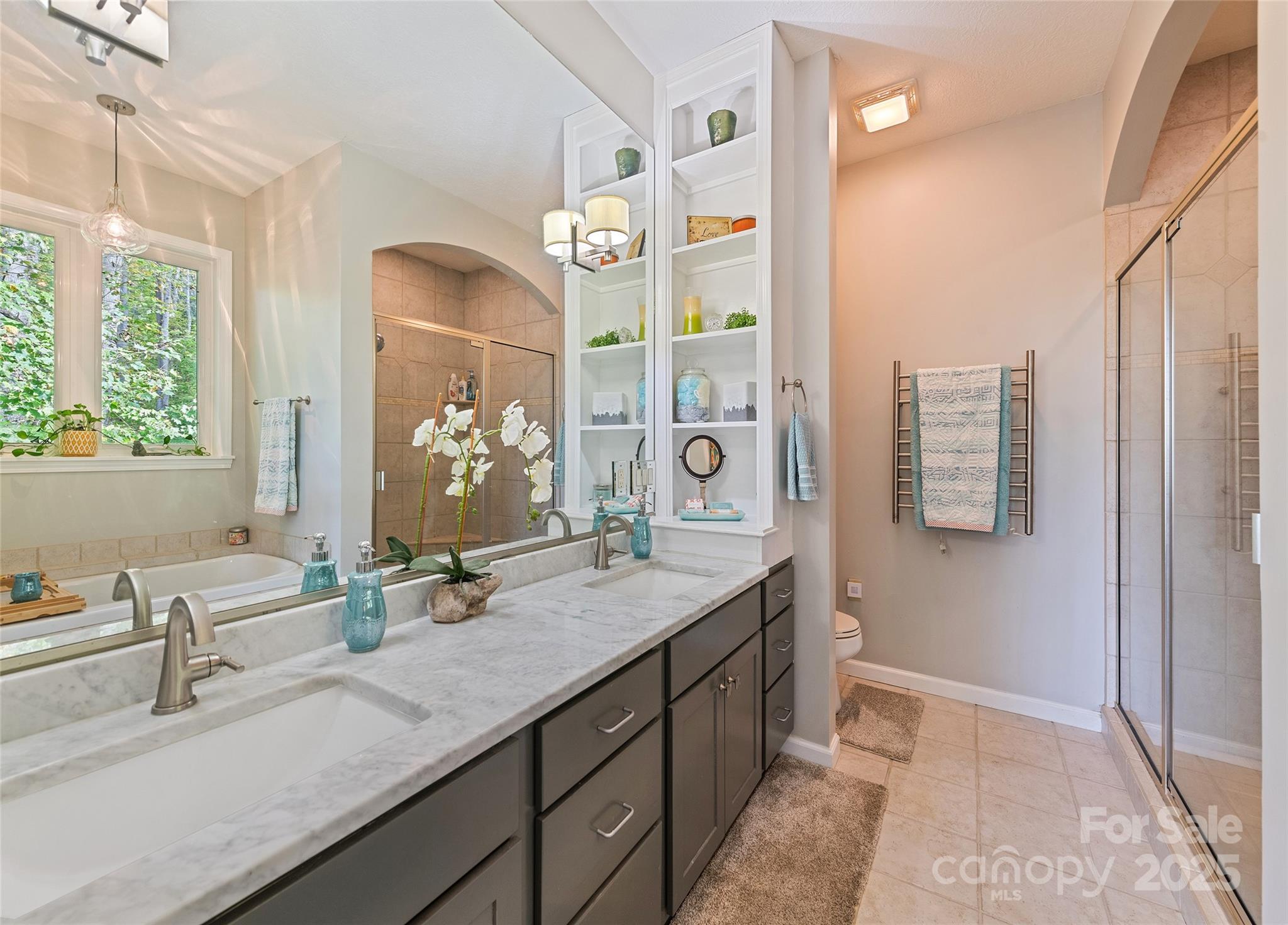 966 Coyote Hollow Road Waynesville, NC 28785 - Photo 15 of 29 a bathroom with a granite countertop sink a mirror and a shower