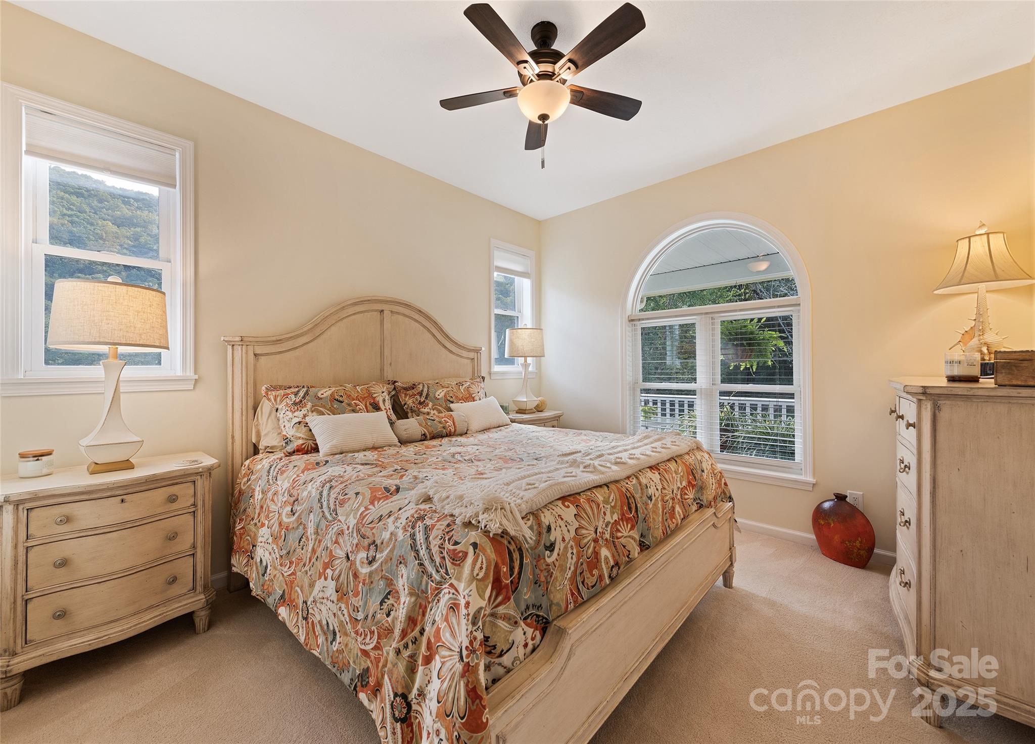 966 Coyote Hollow Road Waynesville, NC 28785 - Photo 16 of 29 a bedroom with a bed and a window