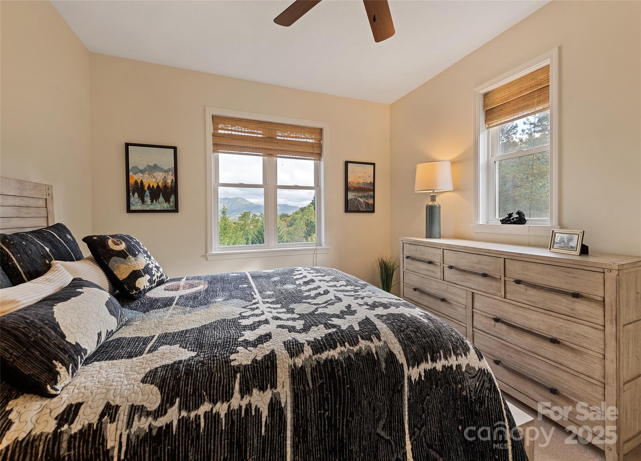 966 Coyote Hollow Road Waynesville, NC 28785 - Photo 18 of 29 a bed sitting in a bedroom next to a window