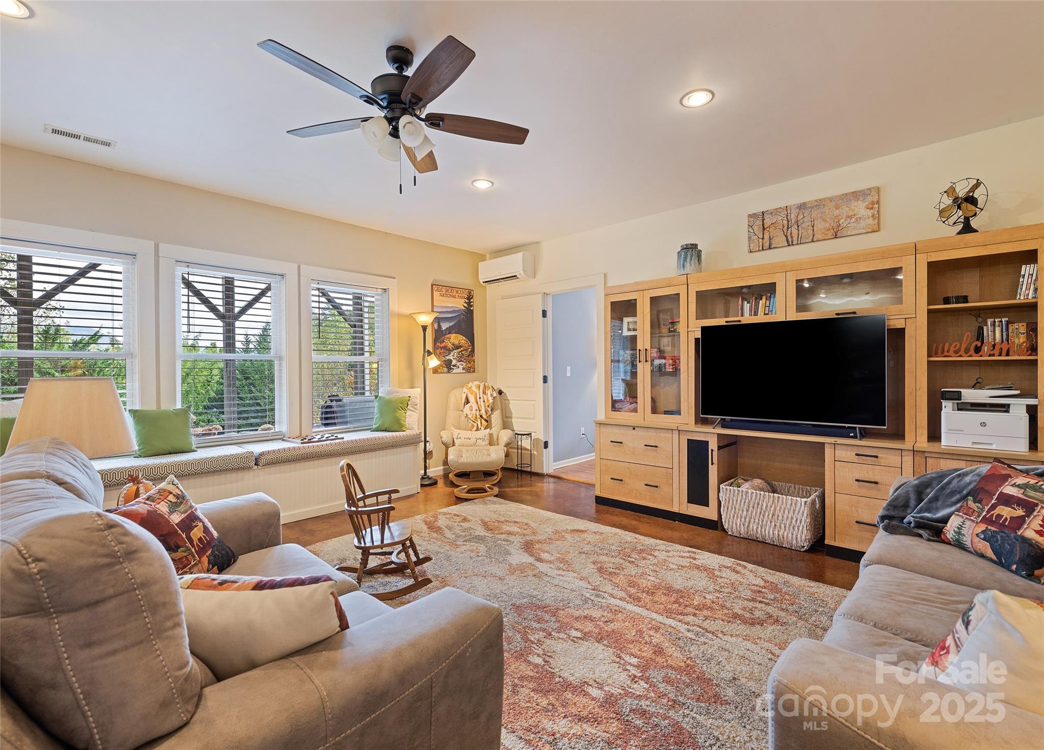 966 Coyote Hollow Road Waynesville, NC 28785 - Photo 21 of 29 a living room with furniture and a flat screen tv