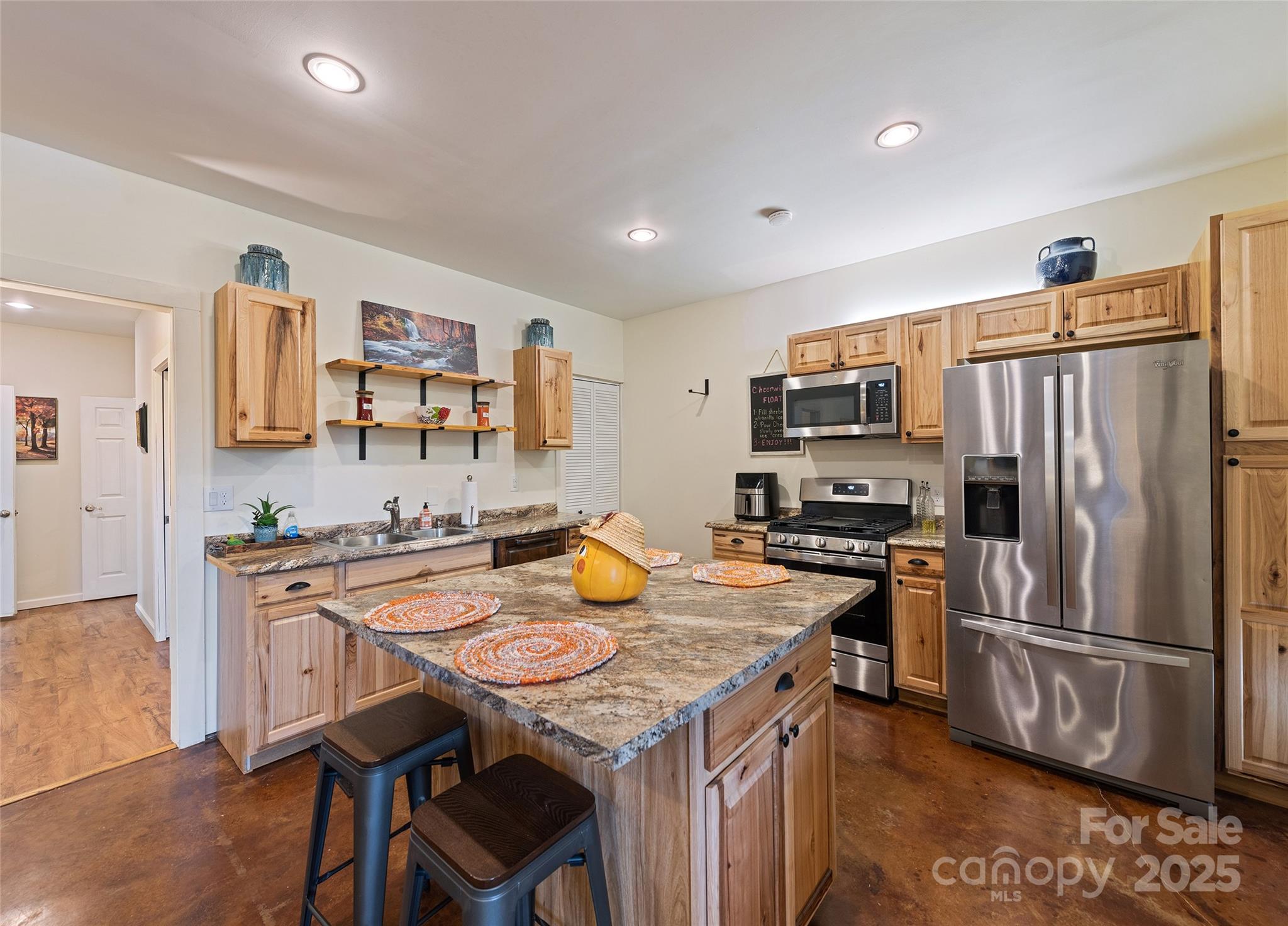 966 Coyote Hollow Road Waynesville, NC 28785 - Photo 22 of 29 a kitchen with stainless steel appliances a stove a sink a refrigerator and a refrigerator