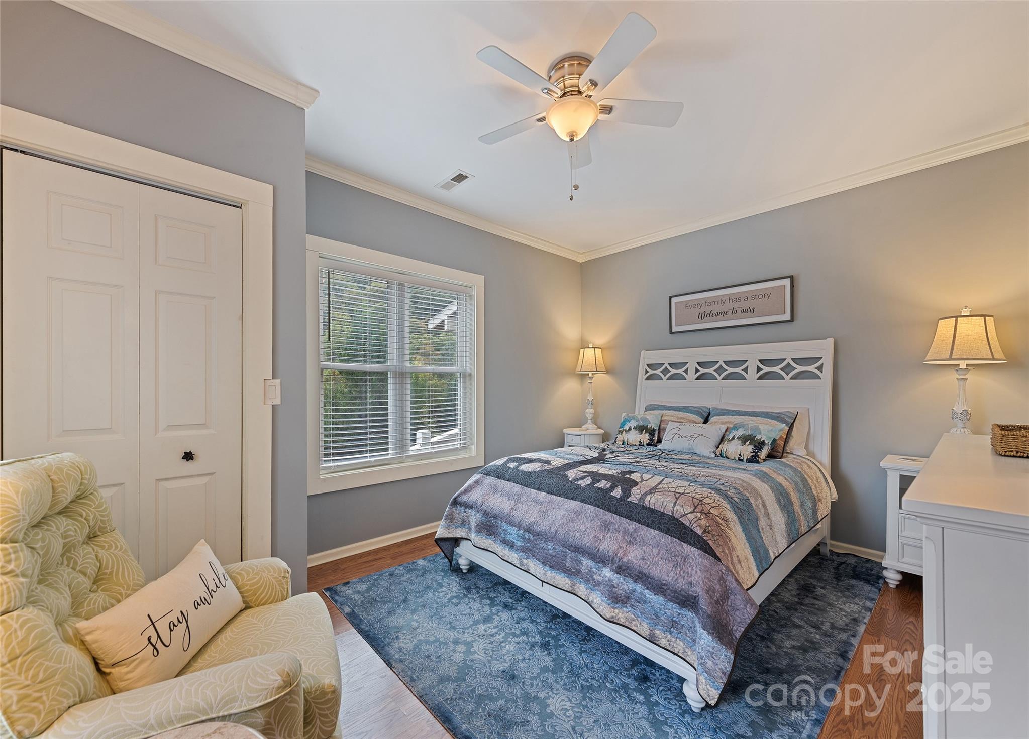 966 Coyote Hollow Road Waynesville, NC 28785 - Photo 23 of 29 a bedroom with a large bed and a window