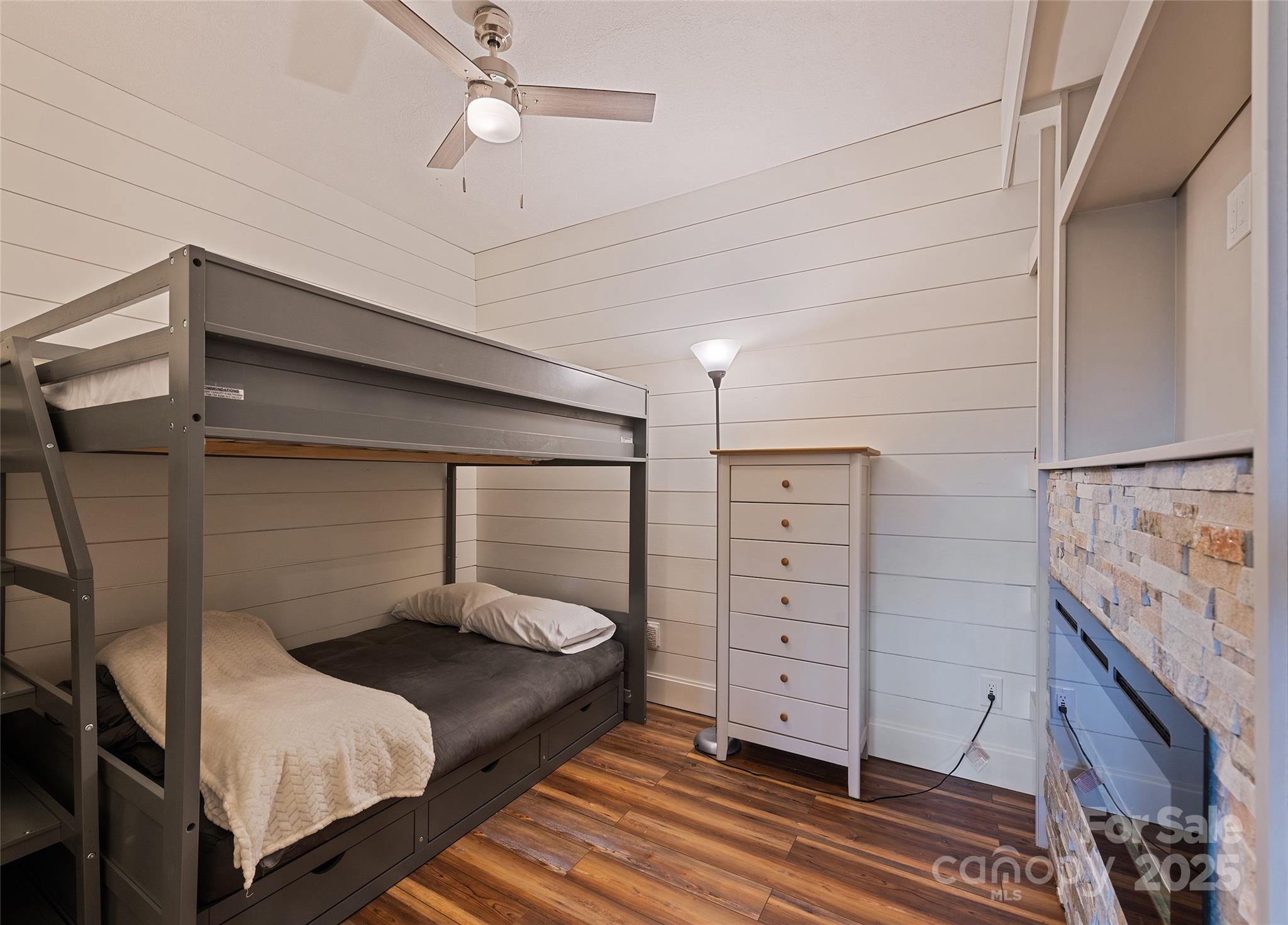 966 Coyote Hollow Road Waynesville, NC 28785 - Photo 25 of 29 a bedroom with a bed and a dresser