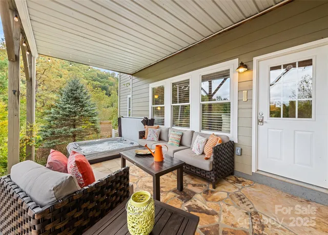 a outdoor space with patio the couches and dining table with a potted plant