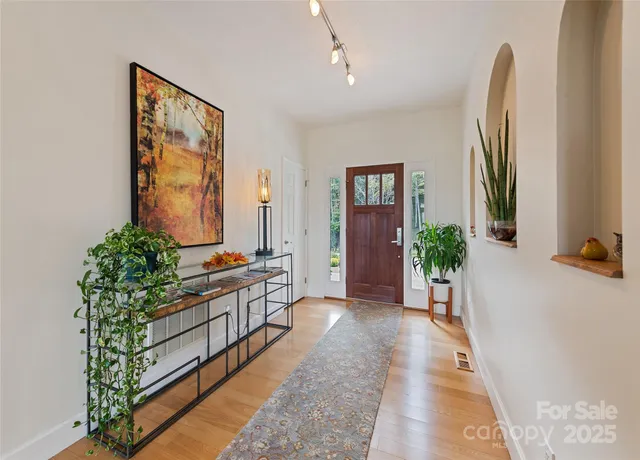 a view of hallway with a potted plant