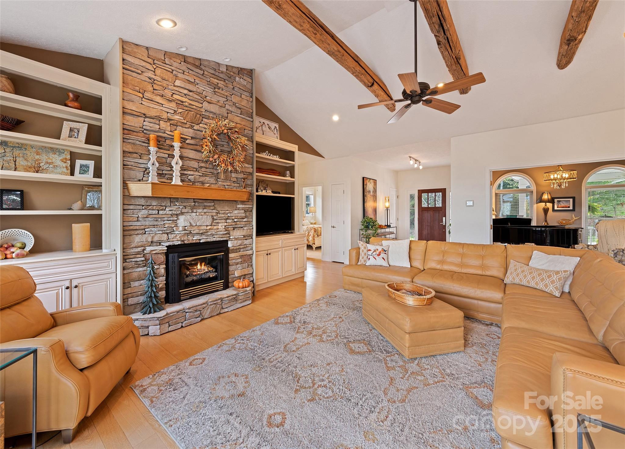 966 Coyote Hollow Road Waynesville, NC 28785 - Photo 6 of 29 a living room with furniture large window and a fireplace
