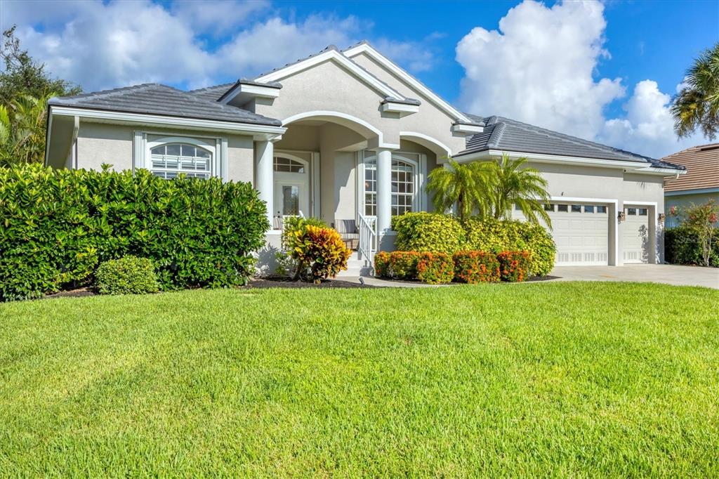 4 Windward Way Placida, FL 33946 - Photo 6 of 39 a front view of a house with garden
