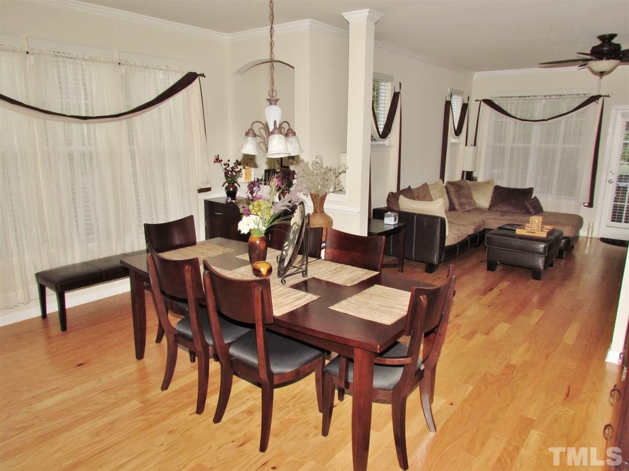 2916 Casona Way Raleigh, NC 27616 - Photo 3 of 25 a view of a dining room with furniture and wooden floor