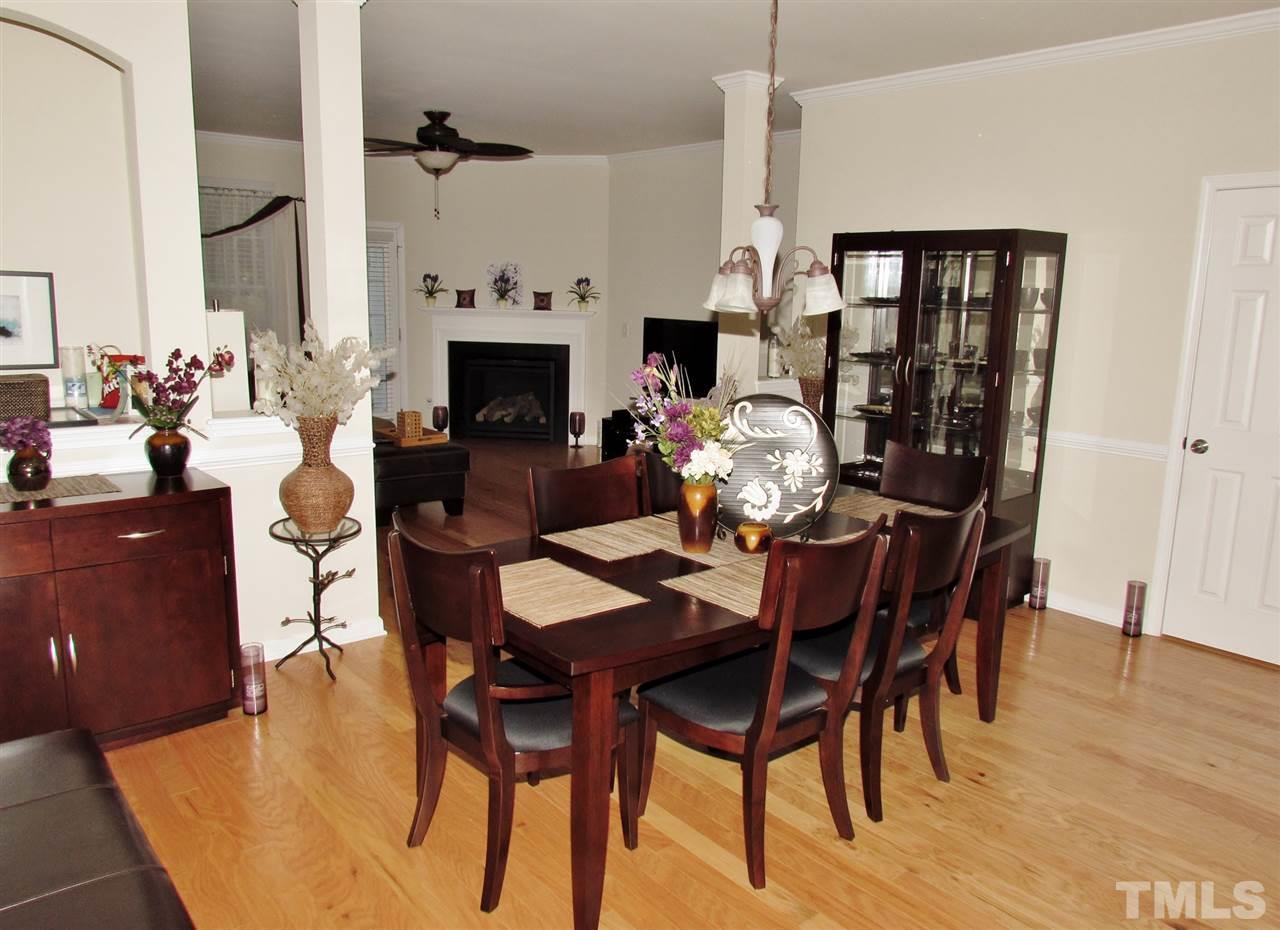 2916 Casona Way Raleigh, NC 27616 - Photo 4 of 25 a dining room with furniture window and wooden floor