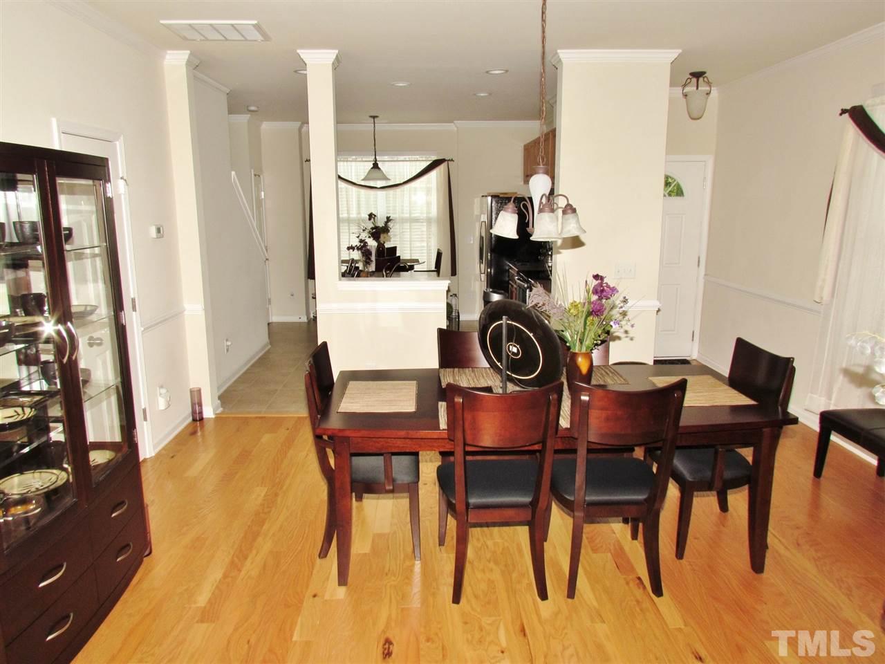 2916 Casona Way Raleigh, NC 27616 - Photo 9 of 25 a dining room with furniture and wooden floor