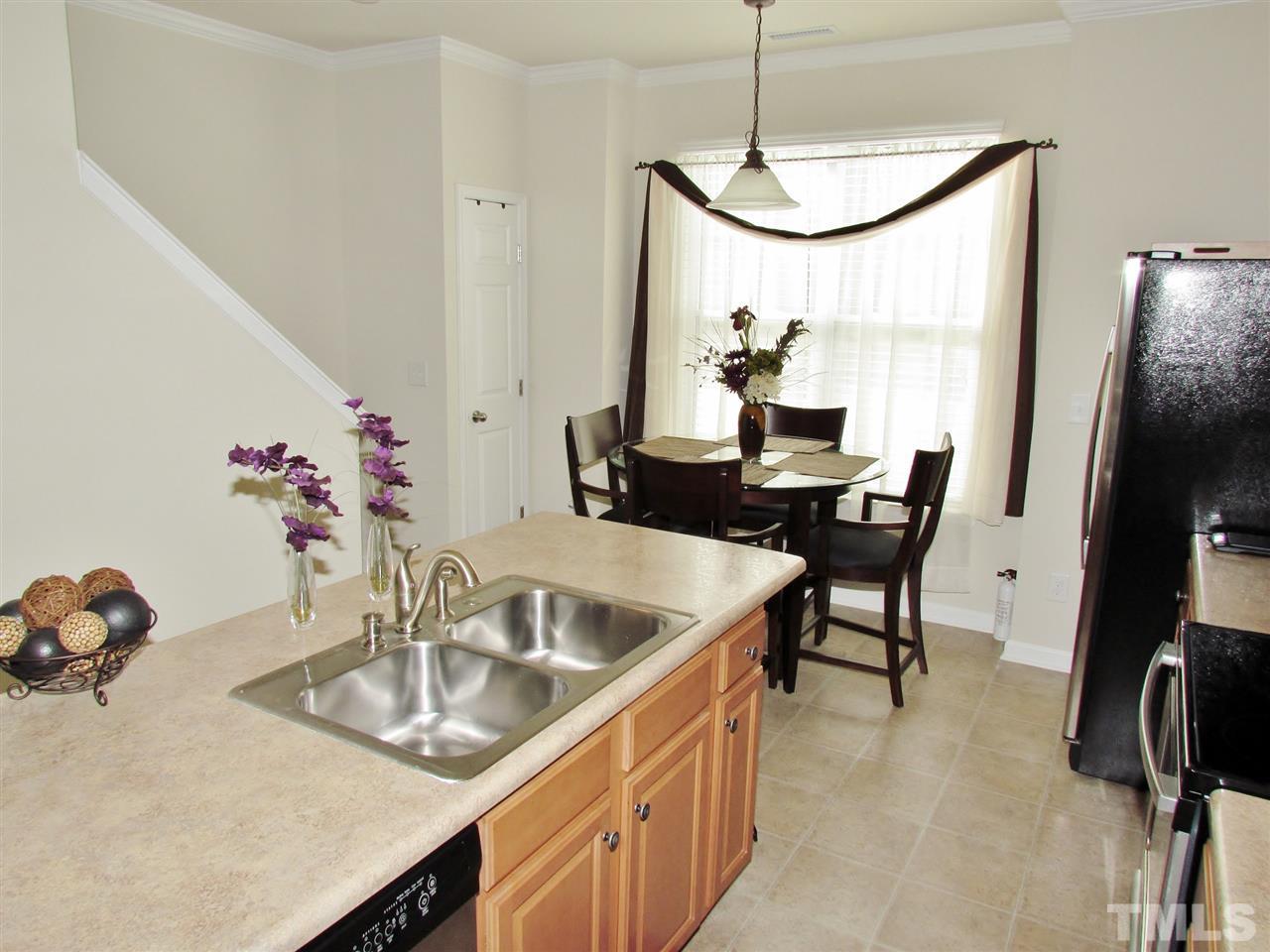 2916 Casona Way Raleigh, NC 27616 - Photo 10 of 25 a dining room with furniture and window
