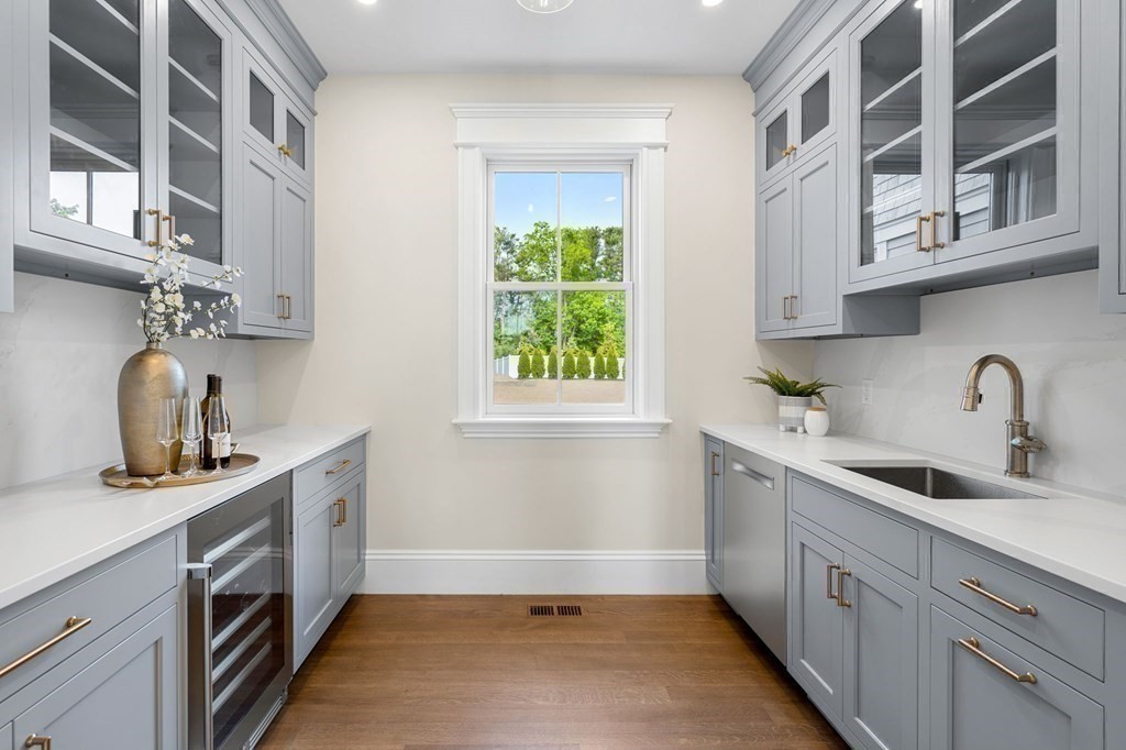 13 Proctor Street Manchester, MA 01944 - Photo 11 of 41 a kitchen with stainless steel appliances a sink stove and cabinets