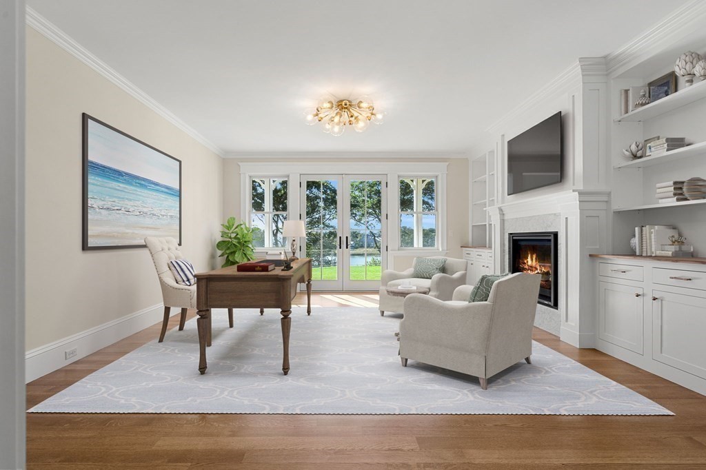 13 Proctor Street Manchester, MA 01944 - Photo 21 of 41 a living room with furniture a fireplace and a flat screen tv
