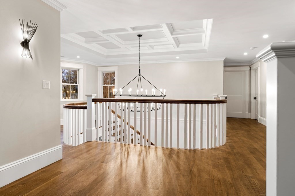 13 Proctor Street Manchester, MA 01944 - Photo 24 of 41 a view of a hallway with wooden floor and stairs
