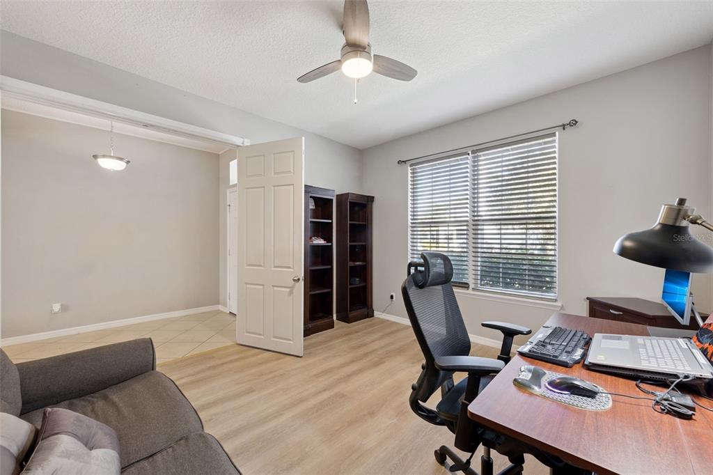 3940 Pine Gate Trail Orlando, FL 32824 - Photo 11 of 36 a view of a workspace with furniture and a window