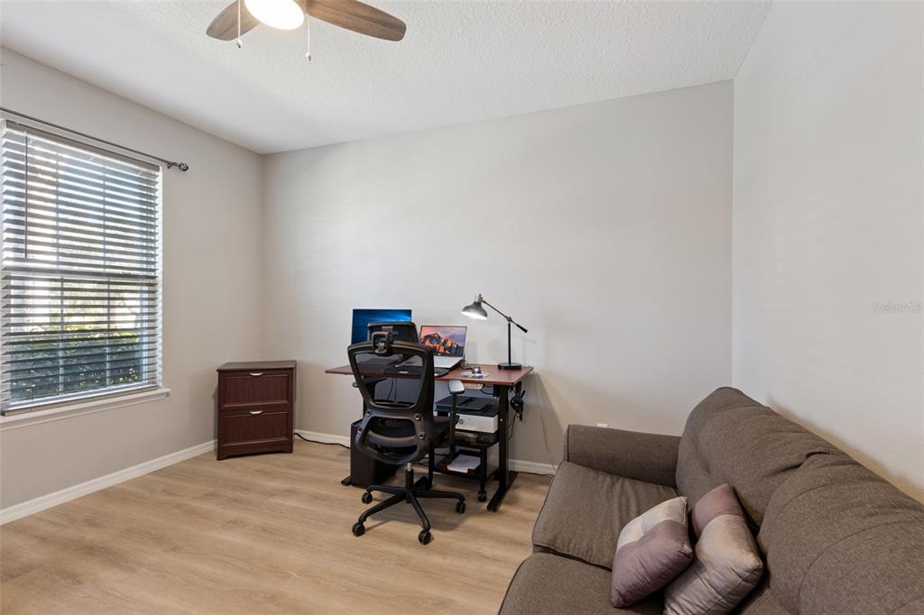 3940 Pine Gate Trail Orlando, FL 32824 - Photo 12 of 36 a bedroom with furniture and a window