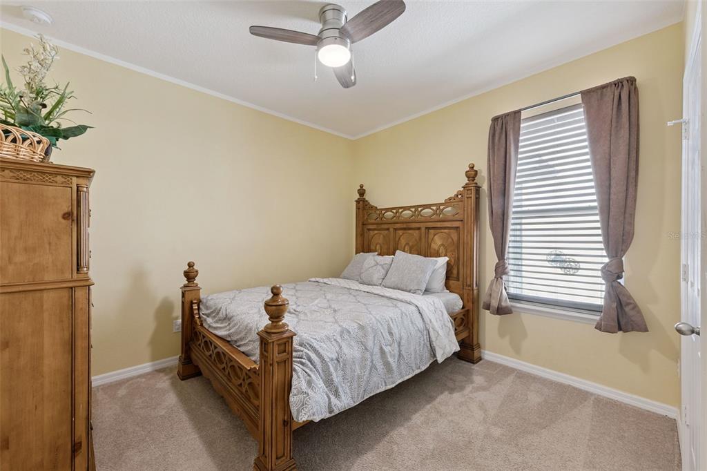 3940 Pine Gate Trail Orlando, FL 32824 - Photo 13 of 36 a bedroom with a bed and a window