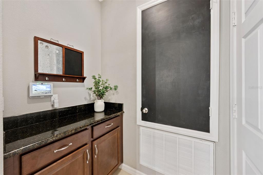 3940 Pine Gate Trail Orlando, FL 32824 - Photo 20 of 36 a bathroom with a granite countertop sink and a mirror