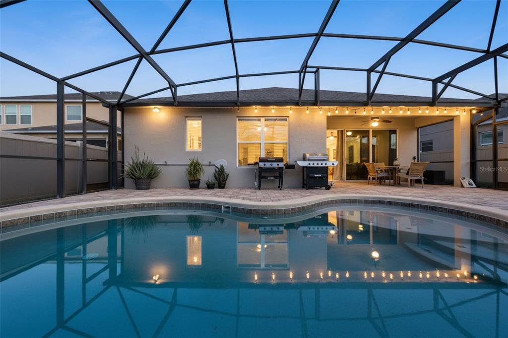 3940 Pine Gate Trail Orlando, FL 32824 - Photo 28 of 36 a kitchen with a sink a counter top stainless steel appliances and cabinets