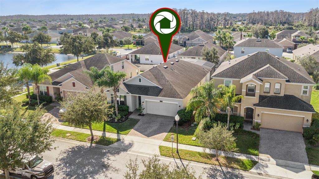 3940 Pine Gate Trail Orlando, FL 32824 - Photo 29 of 36 a view of a house with a park and a forest