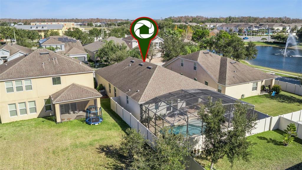 3940 Pine Gate Trail Orlando, FL 32824 - Photo 30 of 36 an aerial view of a house with a garden and lake view