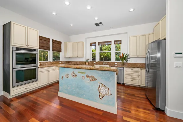 a kitchen with a sink stove and refrigerator