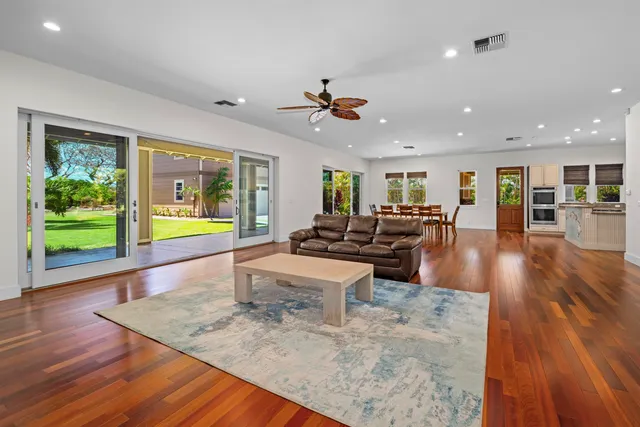 a view of a dining area with furniture and wooden floor