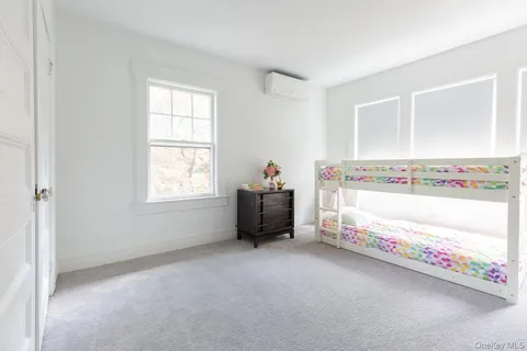 a room with a window and a couch