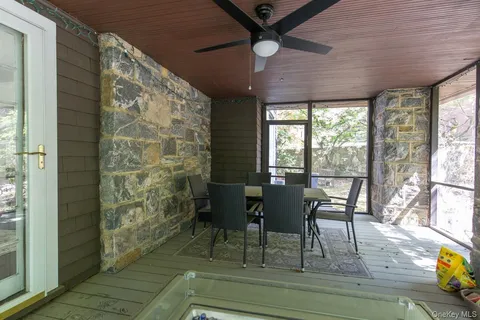 a dining room with furniture and wooden floor
