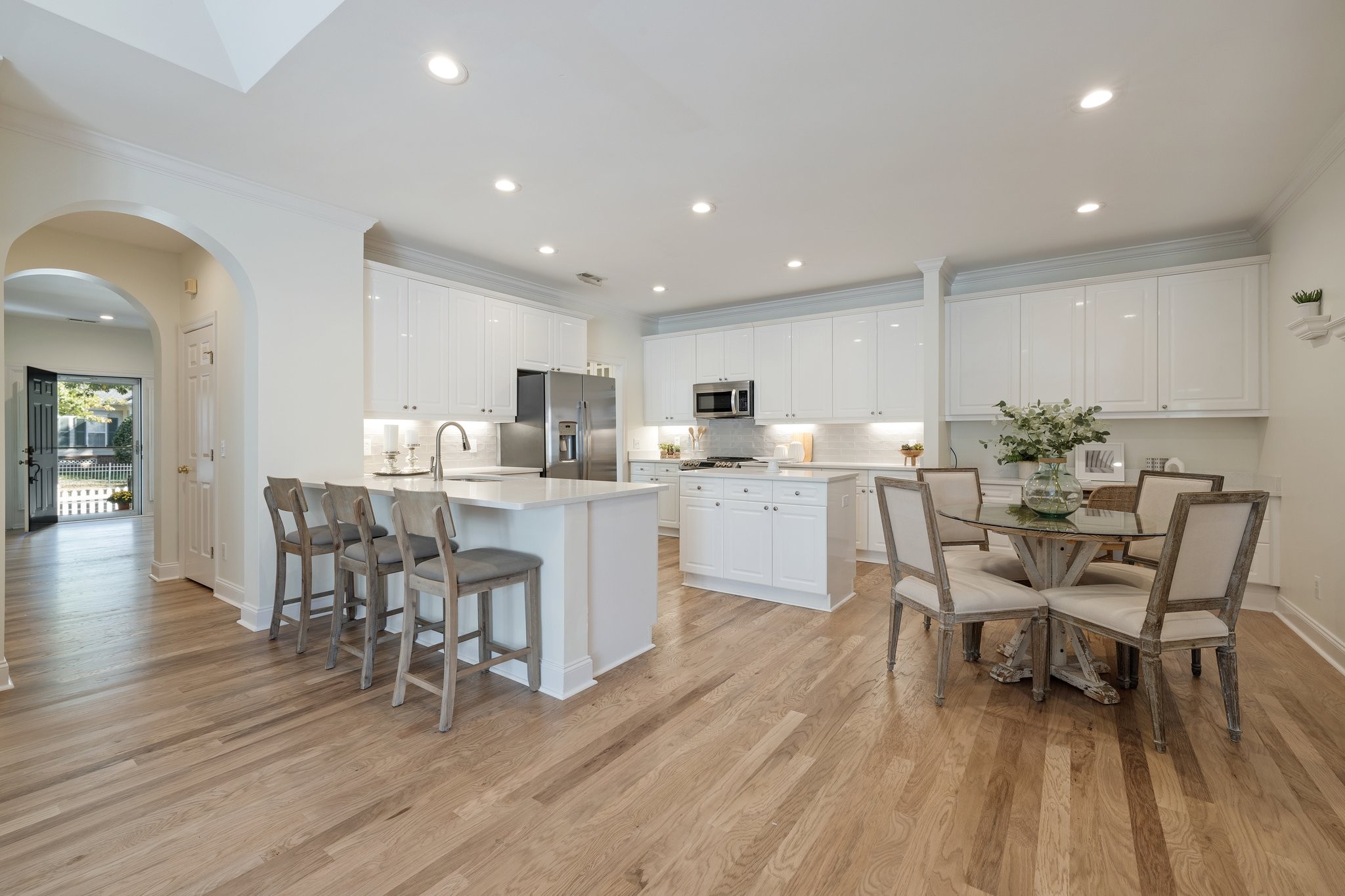 541 Marigold Drive Franklin, TN 37064 - Photo 15 of 69 a kitchen with a dining table chairs and wooden floor