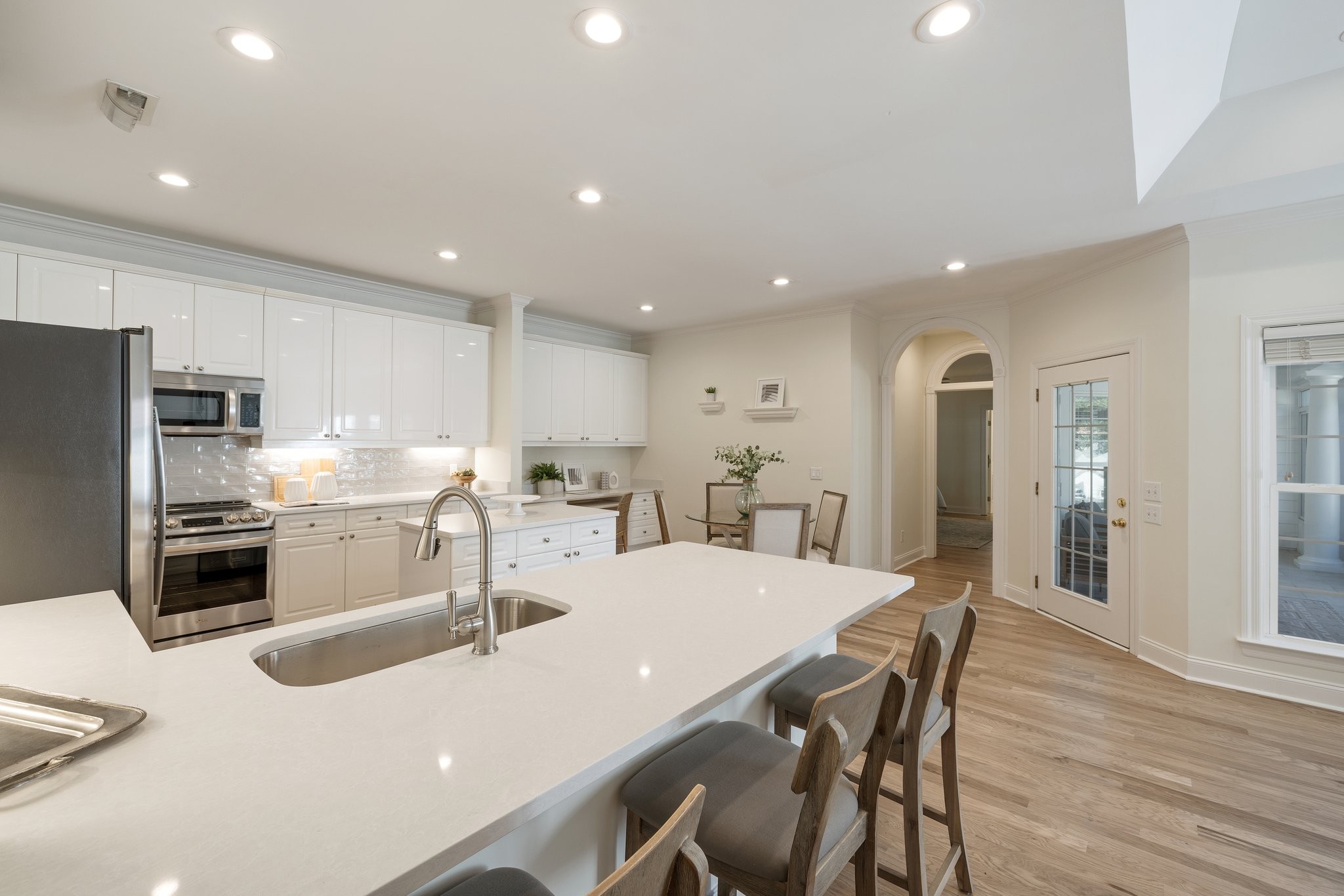 541 Marigold Drive Franklin, TN 37064 - Photo 23 of 69 a kitchen with refrigerator and chairs
