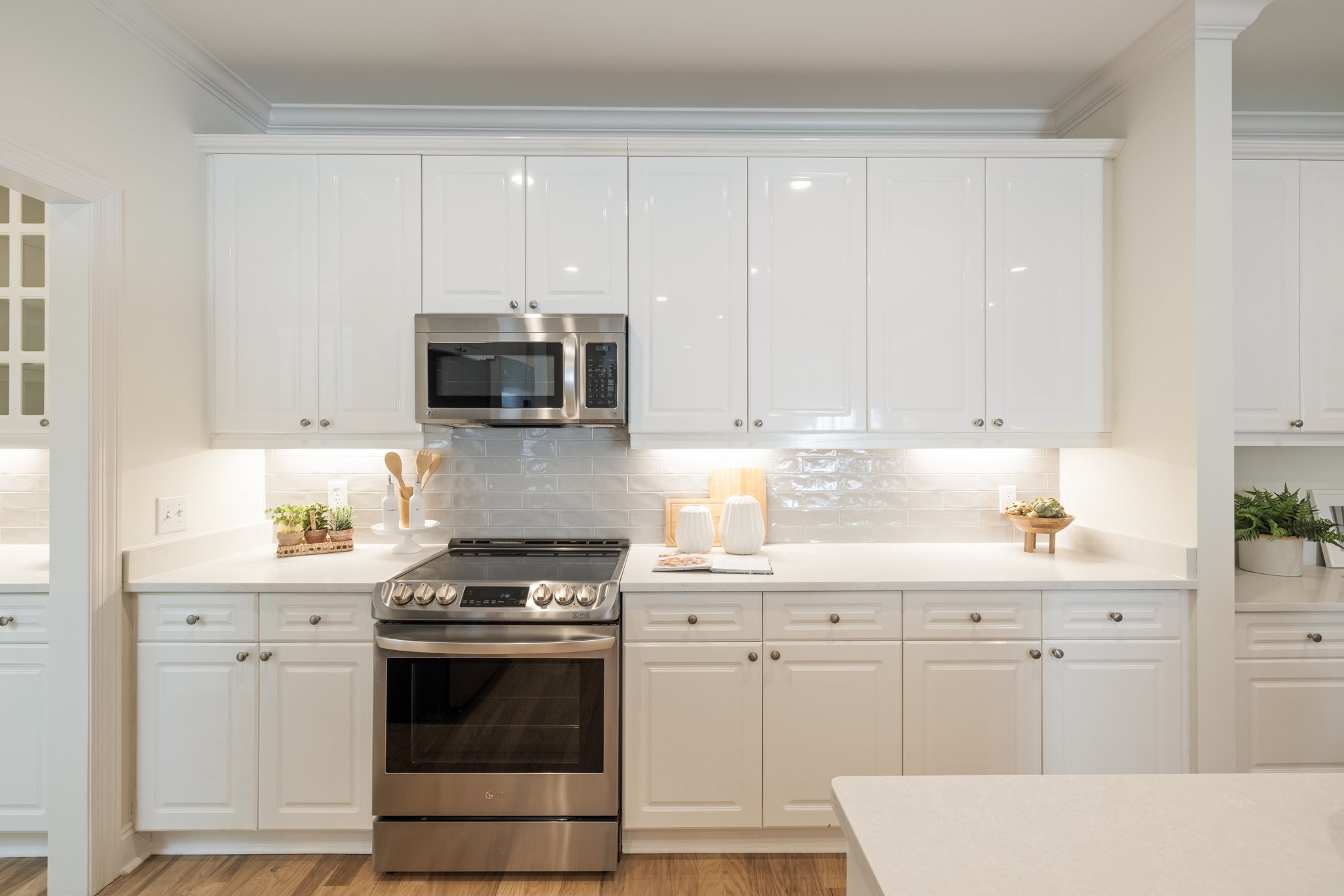 541 Marigold Drive Franklin, TN 37064 - Photo 24 of 69 a kitchen with white cabinets and stainless steel appliances
