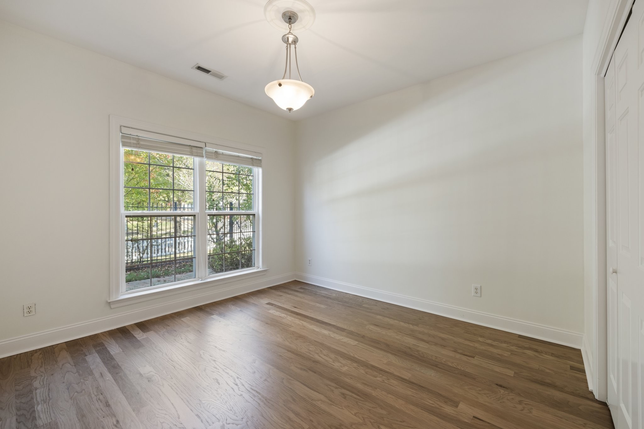541 Marigold Drive Franklin, TN 37064 - Photo 37 of 69 an empty room with wooden floor and windows